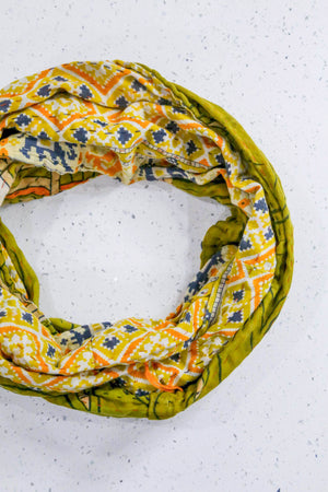 Handmade Kantha infinity scarf with vibrant stitching and beautiful saree patterns, offering a stylish and cozy accessory for year-round wear.