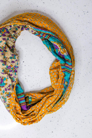 Handmade Kantha infinity scarf with vibrant stitching and beautiful saree patterns, offering a stylish and cozy accessory for year-round wear.