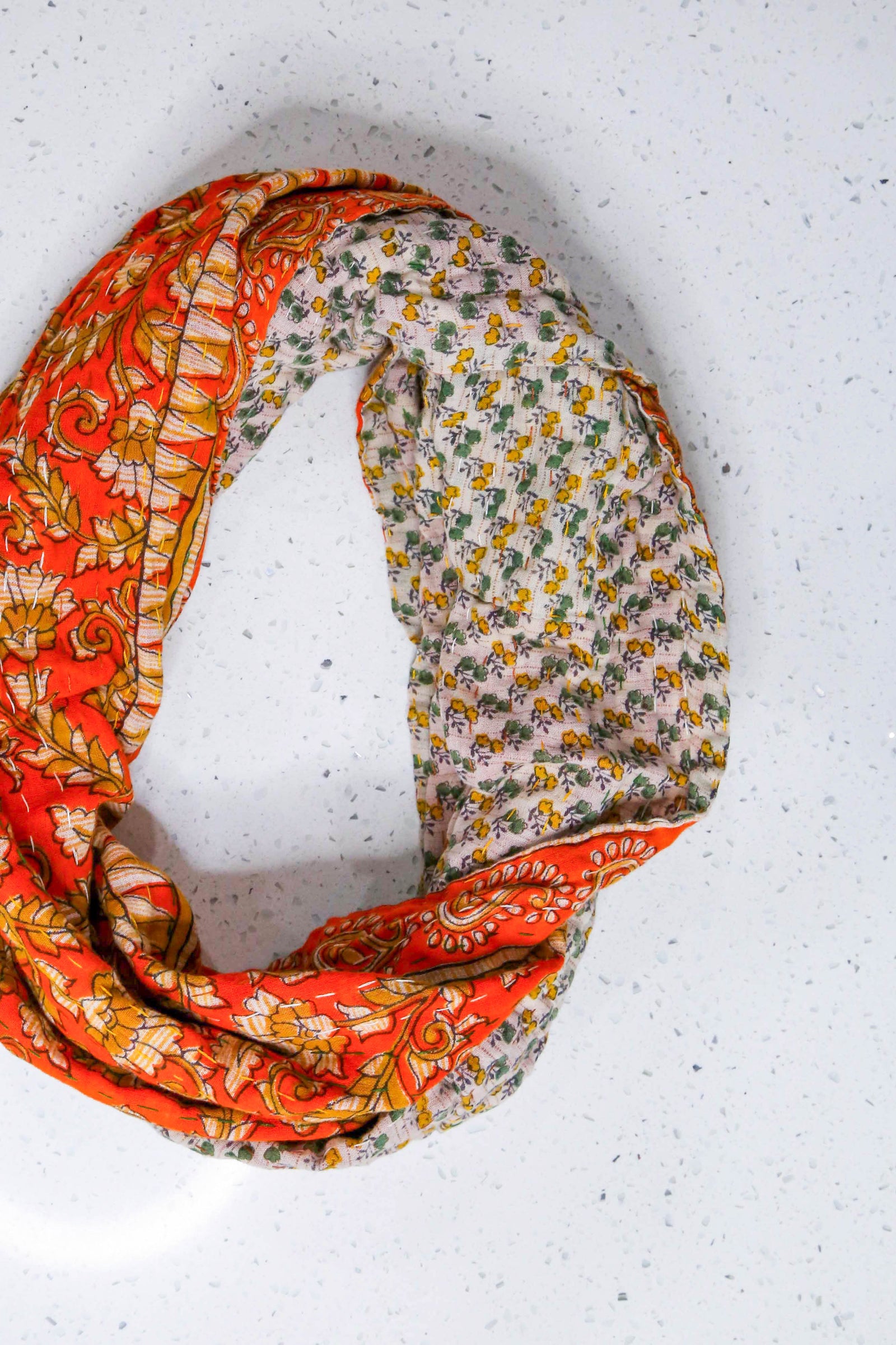 Handmade Kantha infinity scarf with vibrant stitching and beautiful saree patterns, offering a stylish and cozy accessory for year-round wear.
