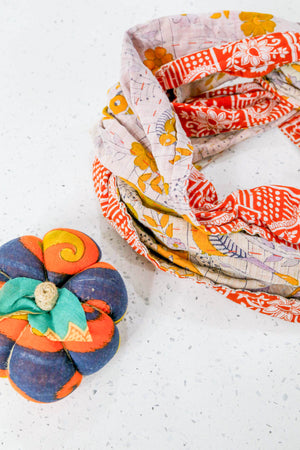 Handmade Kantha infinity scarf with vibrant stitching and beautiful saree patterns, offering a stylish and cozy accessory for year-round wear.
