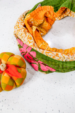 Handmade Kantha infinity scarf with vibrant stitching and beautiful saree patterns, offering a stylish and cozy accessory for year-round wear.