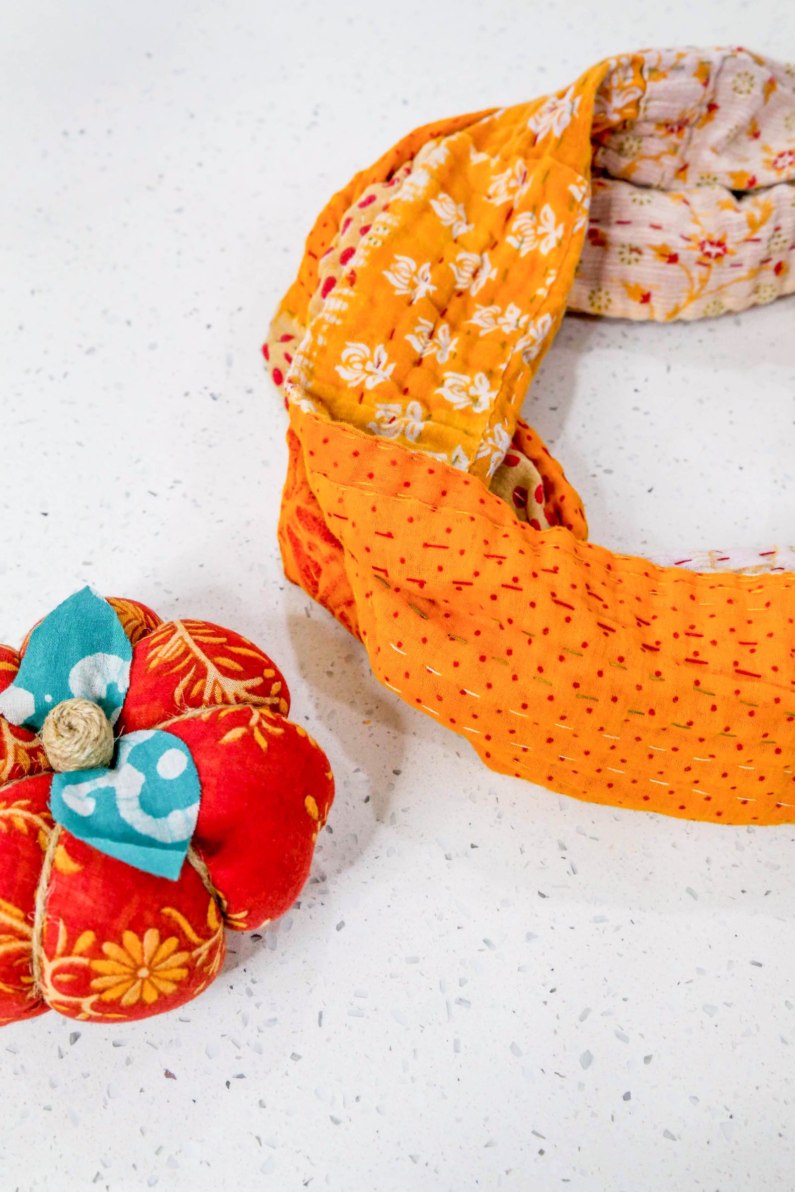 Handmade Kantha infinity scarf with vibrant stitching and beautiful saree patterns, offering a stylish and cozy accessory for year-round wear.