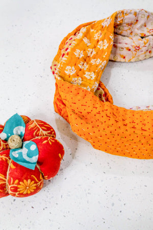 Handmade Kantha infinity scarf with vibrant stitching and beautiful saree patterns, offering a stylish and cozy accessory for year-round wear.