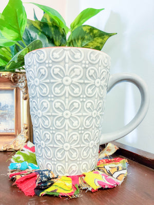 Set of 4 round coasters made from colorful saree scraps, hand-tied to create a vibrant and eco-friendly addition to your home décor.