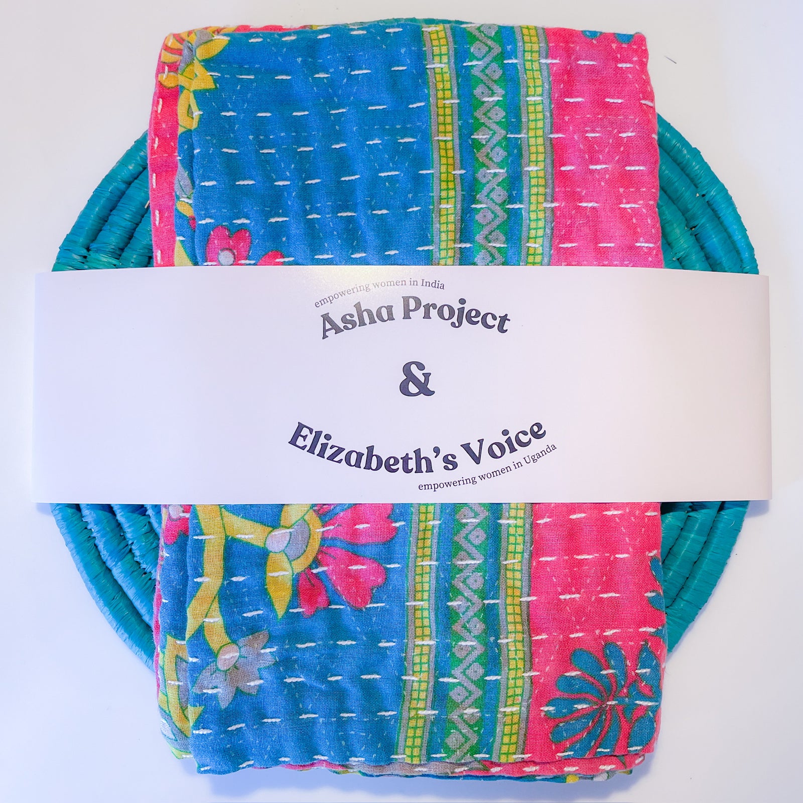 Handmade Kantha kitchen towel paired with a Grass trivet, featuring vibrant fabric patterns and eco-friendly materials, perfect for adding a colorful and functional touch to your kitchen.