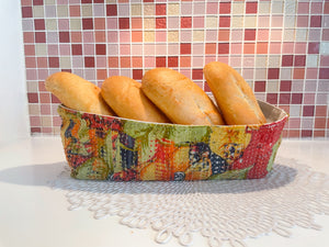 Vintage Kantha bread basket, handcrafted from eco-friendly fabric with vibrant, colorful stitching. The intricate Kantha embroidery features a mix of bold patterns and rich hues, making this basket both a functional and decorative piece. Perfect for serving bread, rolls, or storing small items, it adds a touch of rustic charm and handmade elegance to any kitchen or dining room