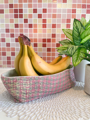 Vintage Kantha bread basket, handcrafted from eco-friendly fabric with vibrant, colorful stitching. The intricate Kantha embroidery features a mix of bold patterns and rich hues, making this basket both a functional and decorative piece. Perfect for serving bread, rolls, or storing small items, it adds a touch of rustic charm and handmade elegance to any kitchen or dining room
