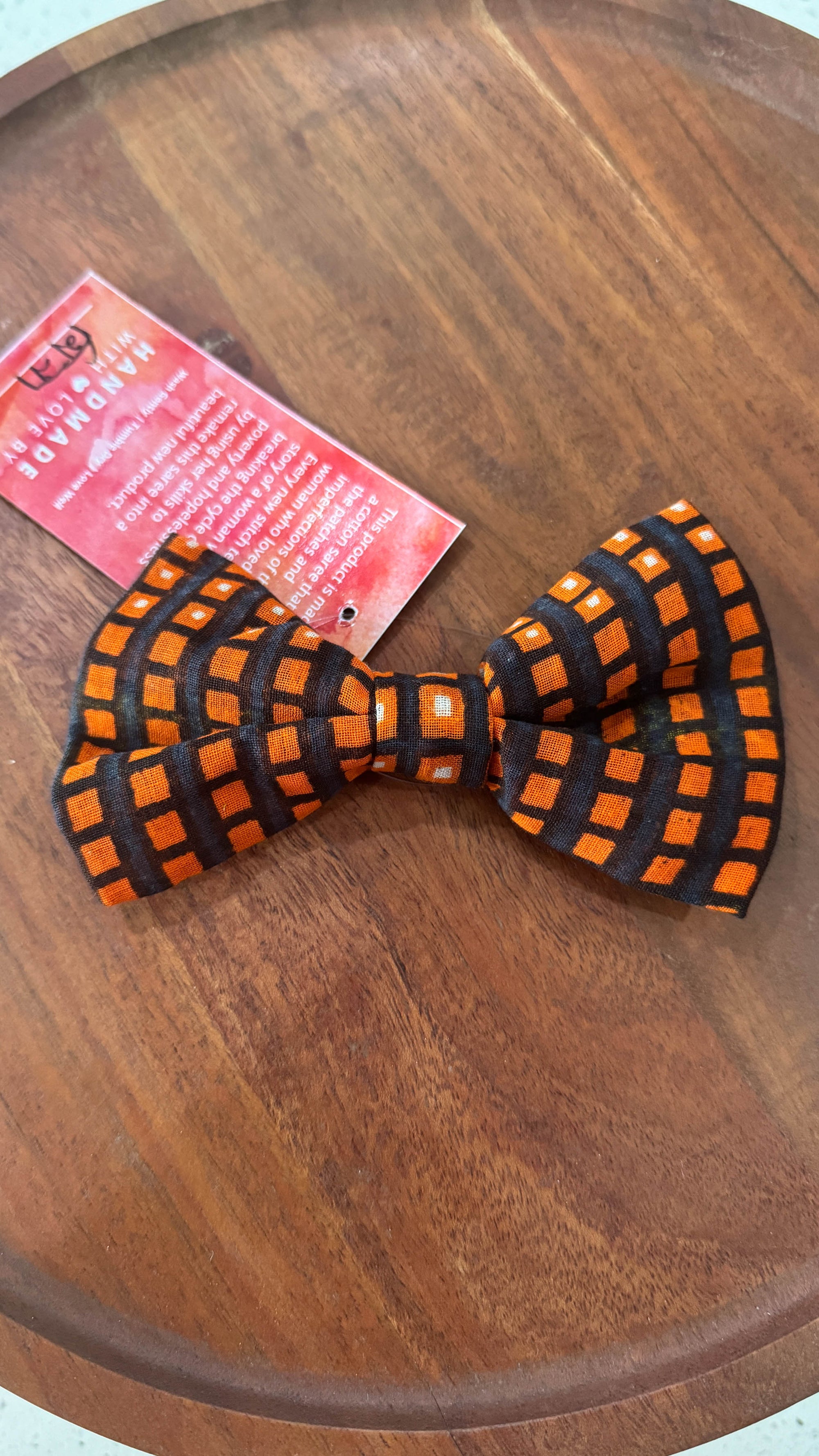 a bow tie sitting on top of a wooden table