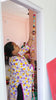 Our artisans working on the saree bead garlands, stringing handmade beads one by one to make a beautiful piece of home decor.