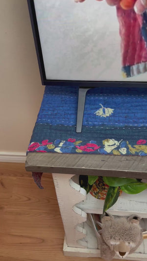 Reversible kantha table runner featuring two vibrant saree  patterns. The runner is stitched with delicate kantha embroidery, adding texture and charm to both sides.