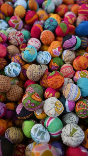 Our artisans working on the saree bead garlands, picking handmade beads one by one to string up  making a beautiful piece of home decor.