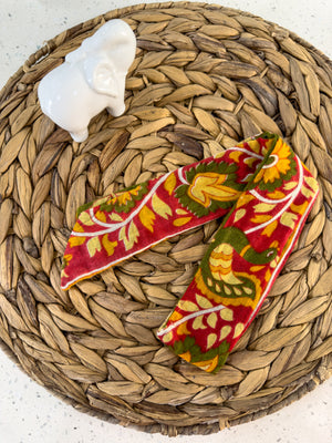 a pair of scissors sitting on top of a woven basket