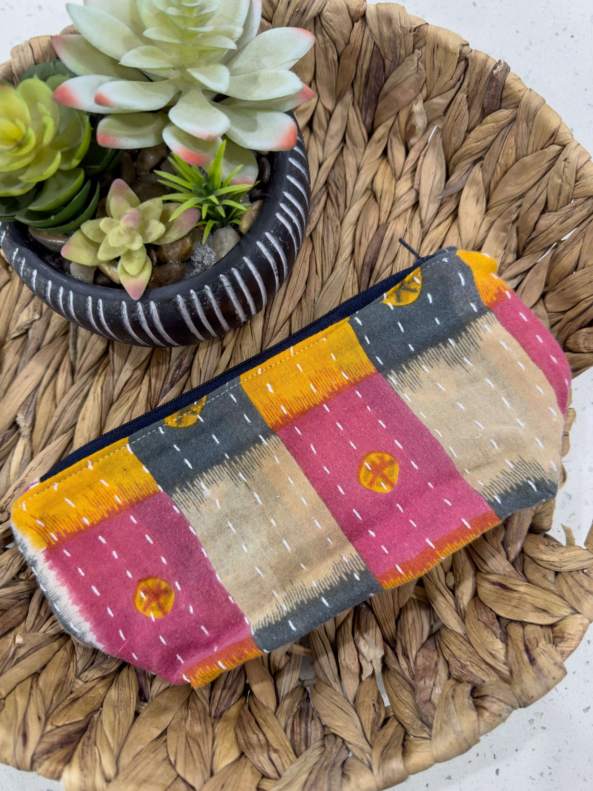 a small purse sitting on top of a wicker tray