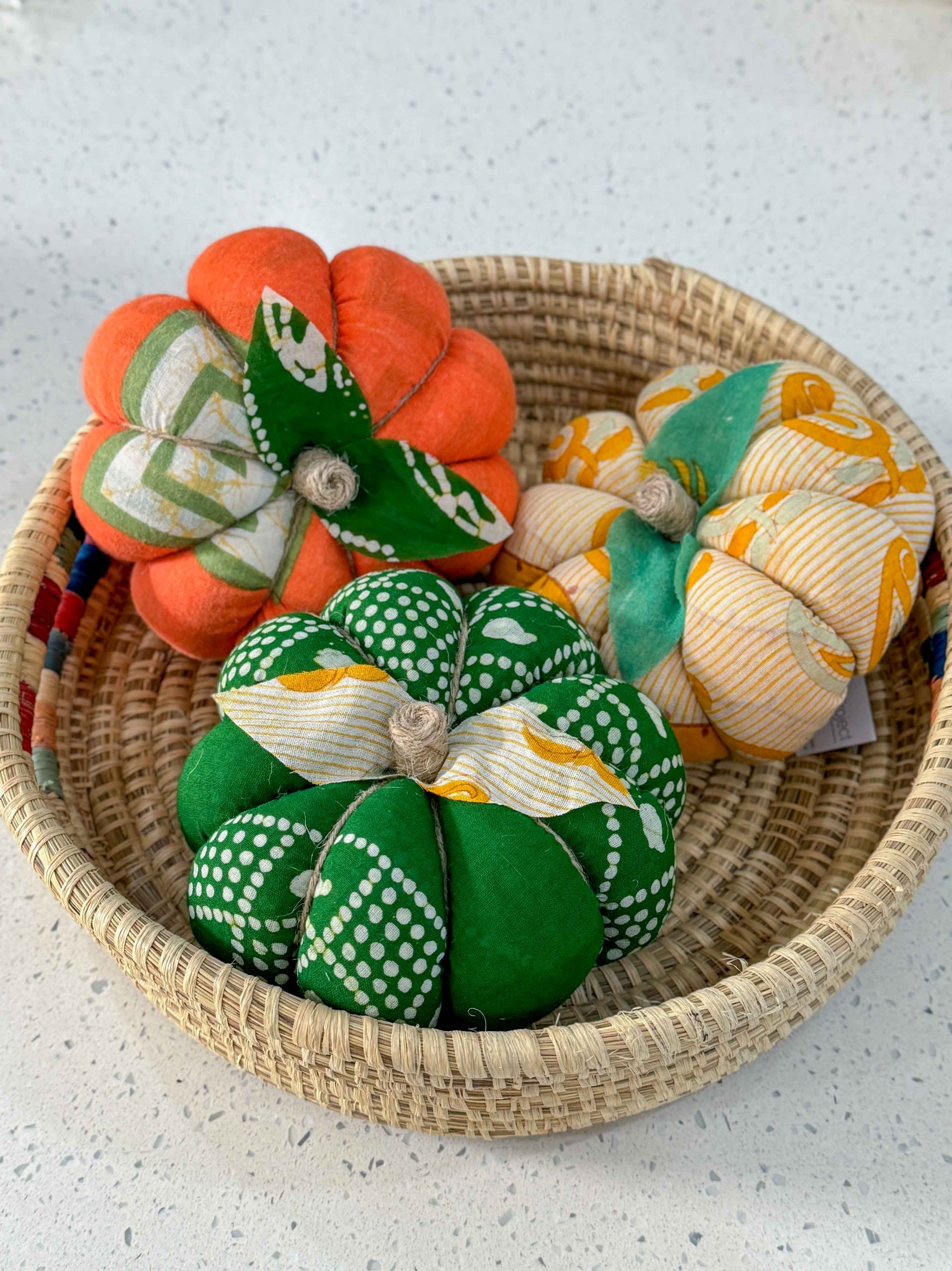 a basket filled with lots of different colored balls