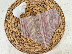 a basket with a cloth and a napkin on it