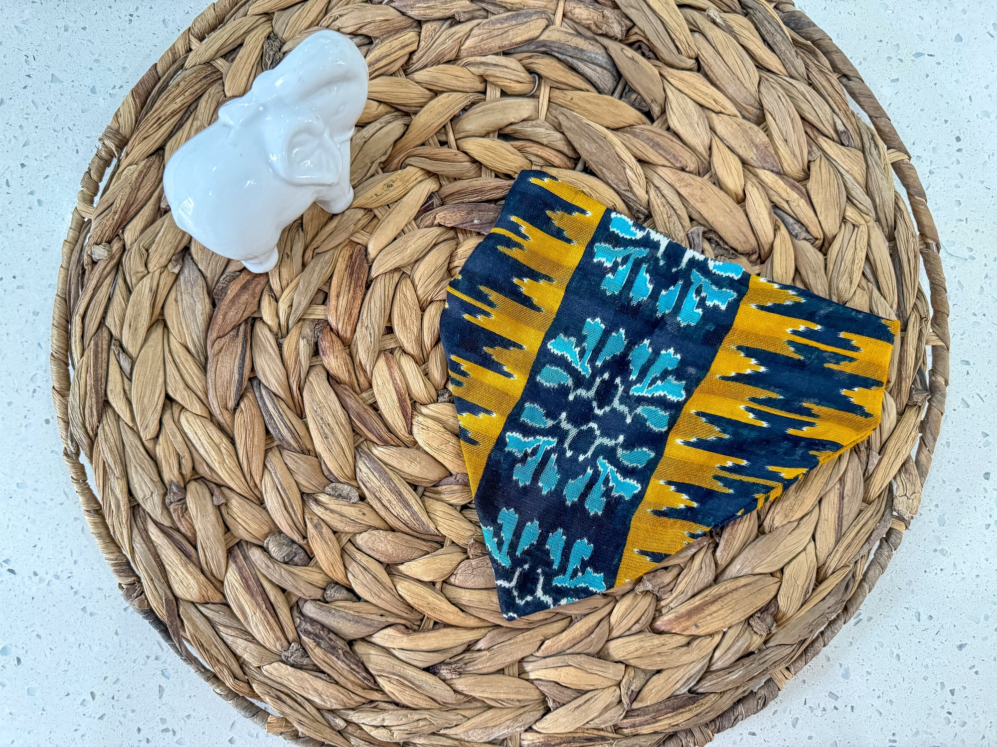 a woven basket with a blue and yellow cloth