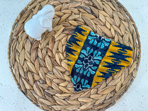 a woven basket with a blue and yellow cloth