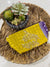 a yellow purse sitting on top of a woven basket