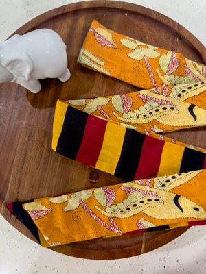 a pair of socks sitting on top of a wooden plate