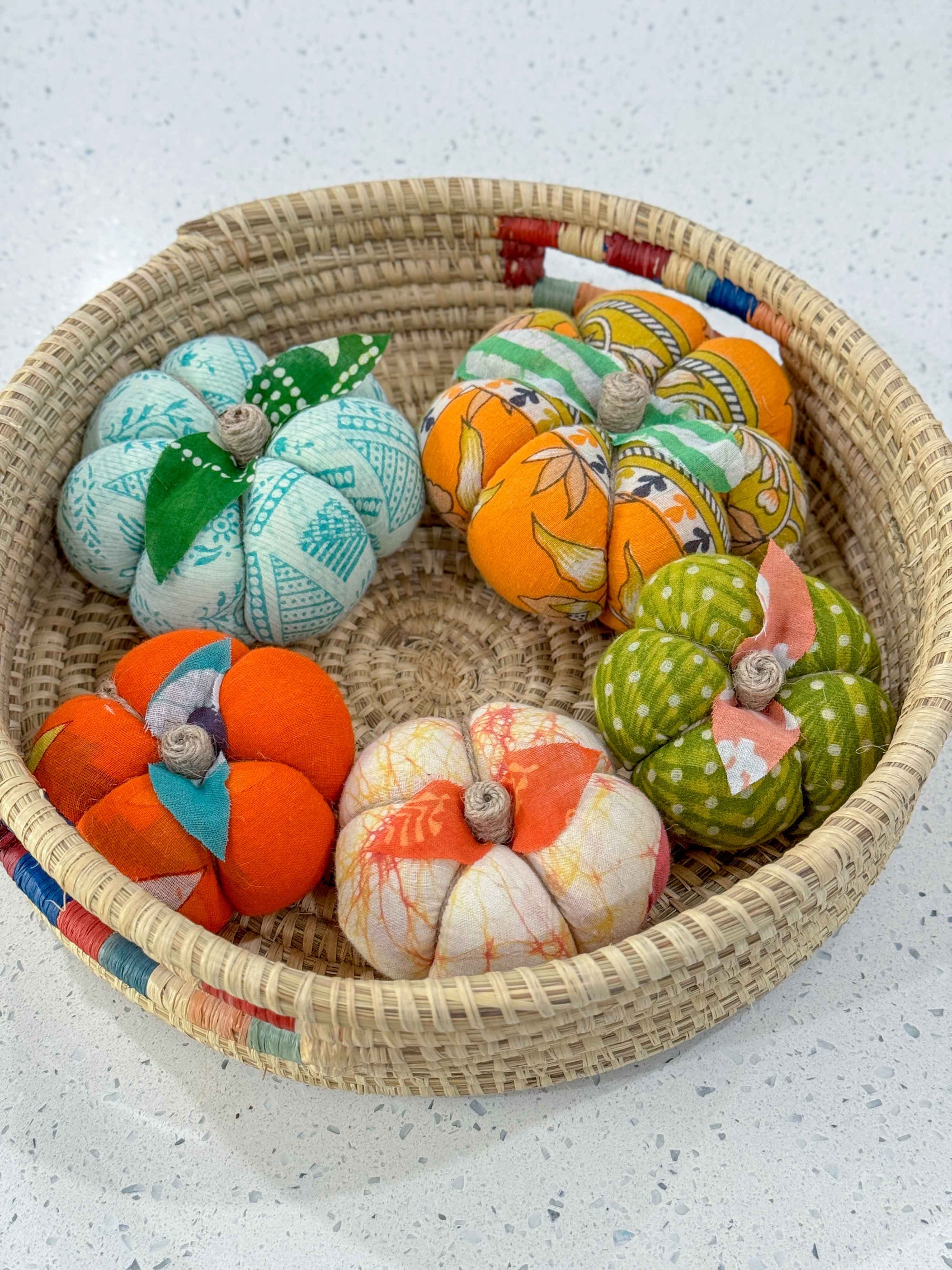 a basket filled with lots of different colored balls