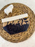 a woven basket with a cloth on top of it