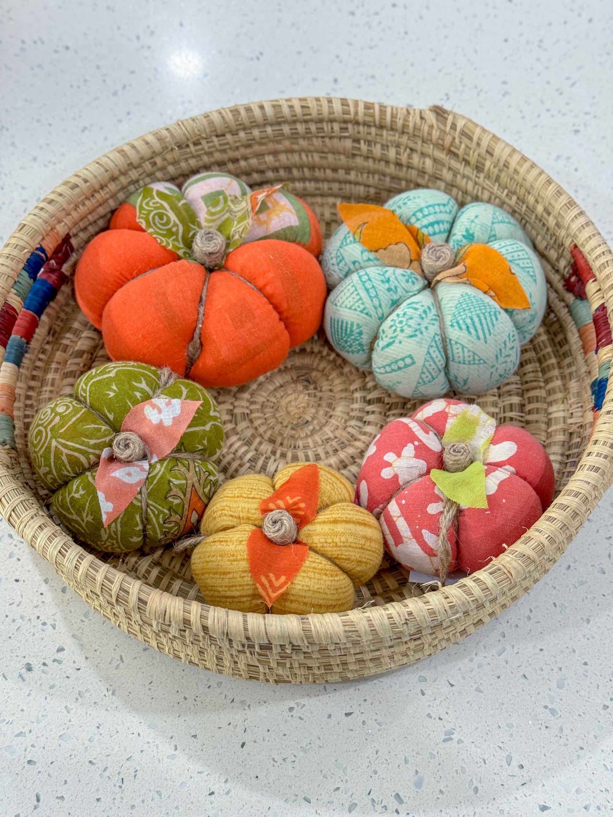 a basket filled with lots of different colored balls