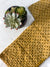 a close up of a tie and a plant on a table