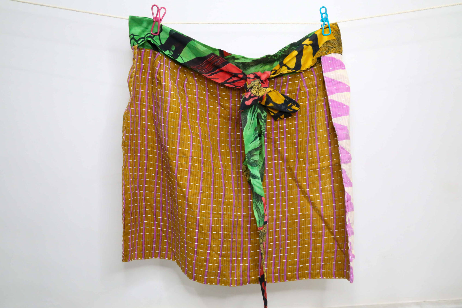 Handmade Kantha half apron with intricate stitching and vibrant fabric patterns, perfect for adding a touch of traditional style to your kitchen while cooking or crafting.