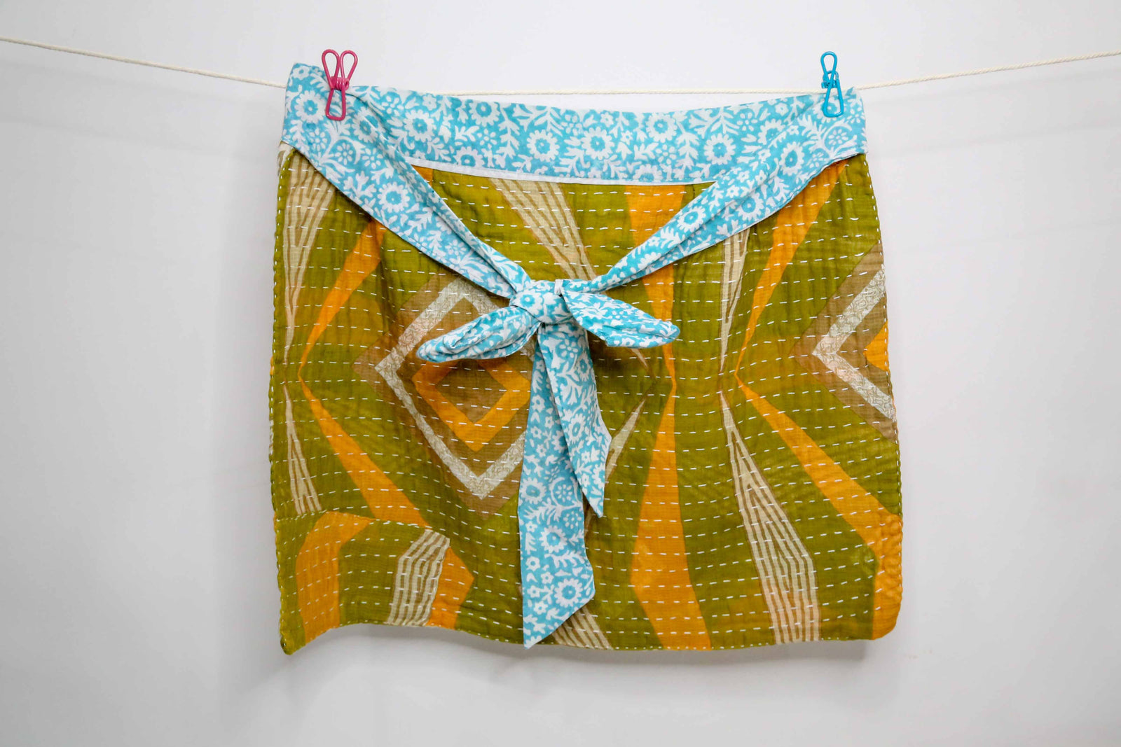 Handmade Kantha half apron with intricate stitching and vibrant fabric patterns, perfect for adding a touch of traditional style to your kitchen while cooking or crafting.