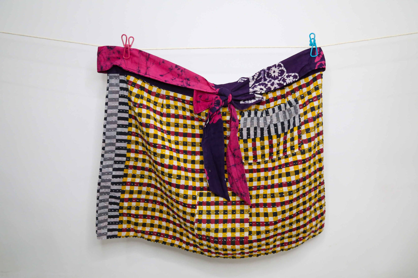 Handmade Kantha half apron with intricate stitching and vibrant fabric patterns, perfect for adding a touch of traditional style to your kitchen while cooking or crafting.