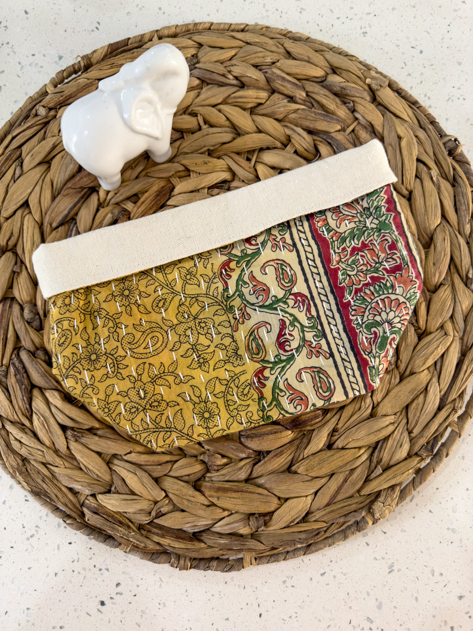 Gold paisley with reds and green floral accents. Handmade Kantha basket with vibrant stitching and traditional saree patterns, perfect for storage, organizing, or adding a pop of color and style to any room.