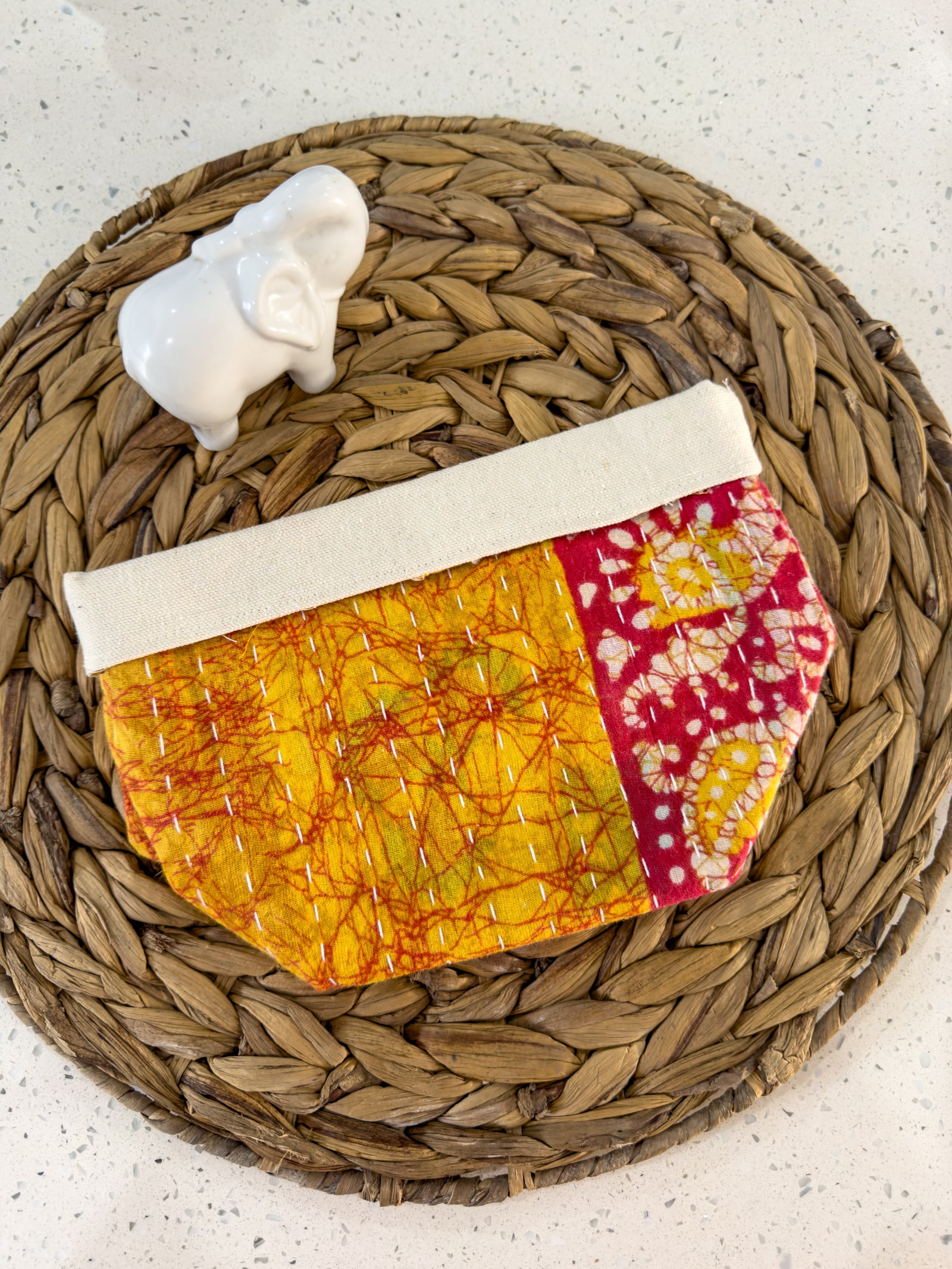 Red and yellow Handmade Kantha basket with vibrant stitching and traditional saree patterns, perfect for storage, organizing, or adding a pop of color and style to any room.