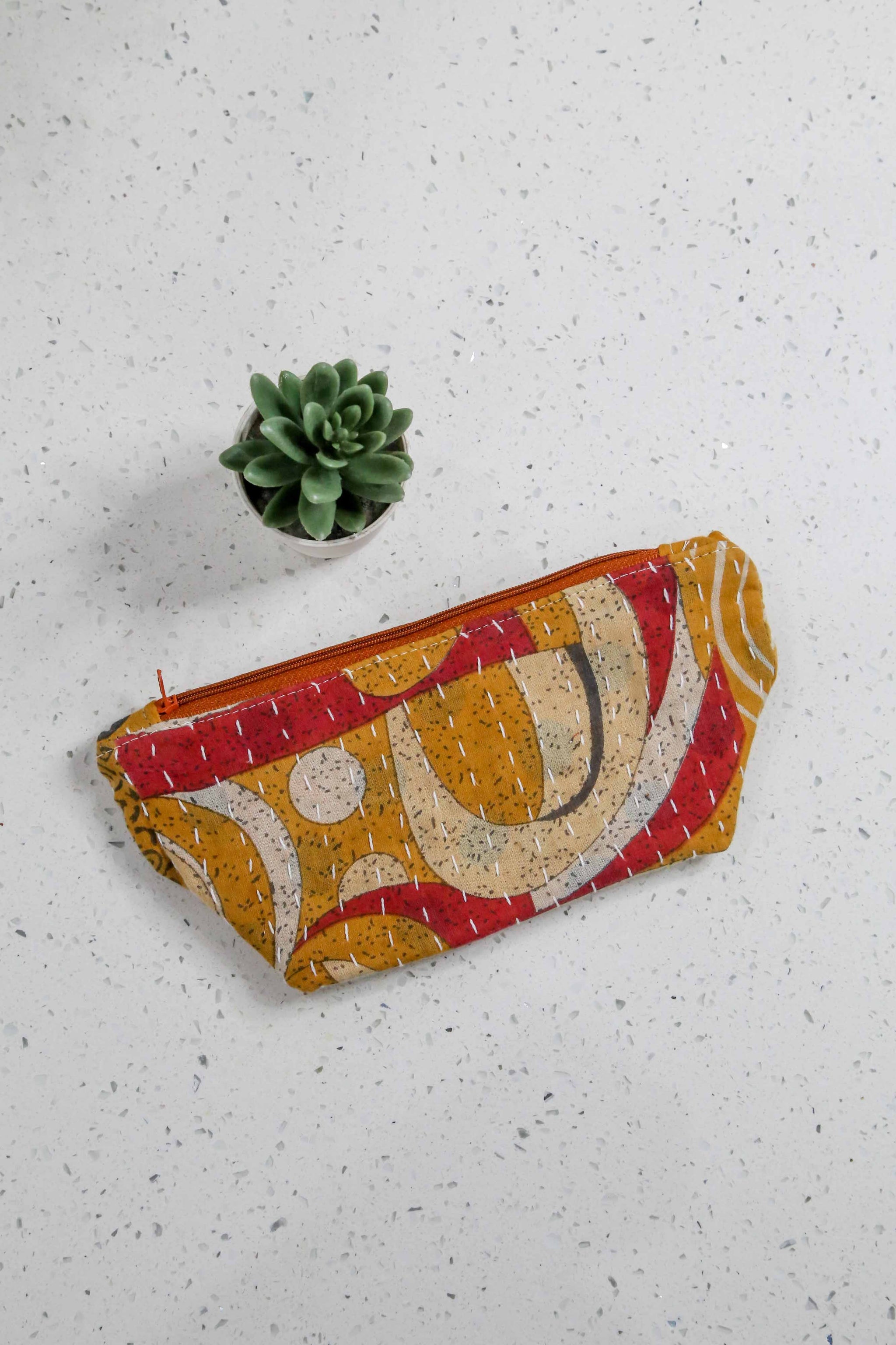 Handmade Kantha cosmetic bag with vibrant saree patterns, perfect for fitting all your to-go items in one stylish, spacious bag for travel or daily use.