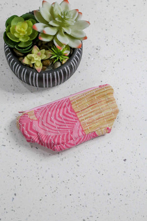 Handmade small Kantha cosmetic bag with vibrant saree patterns, perfect for fitting all your to-go items in one stylish, spacious bag for travel or daily use.