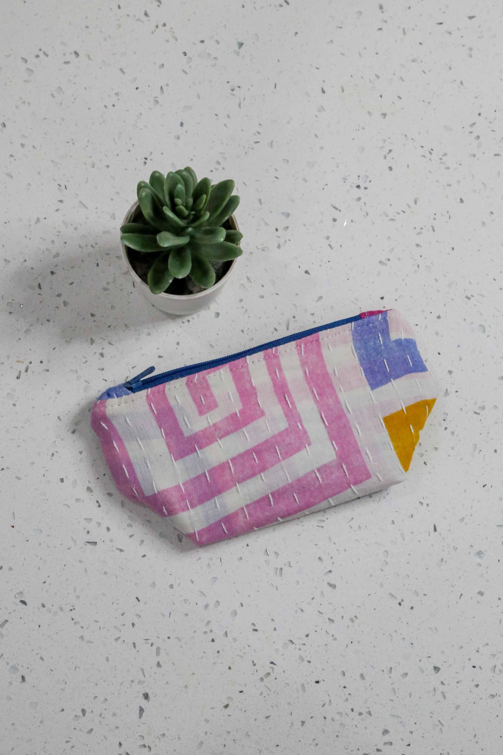 Handmade small Kantha cosmetic bag with vibrant saree patterns, perfect for fitting all your to-go items in one stylish, spacious bag for travel or daily use.