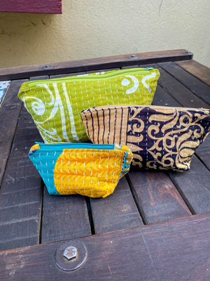 Handmade Kantha cosmetic bags with vibrant saree patterns, perfect for fitting all your to-go items in one stylish, spacious bag for travel or daily use.