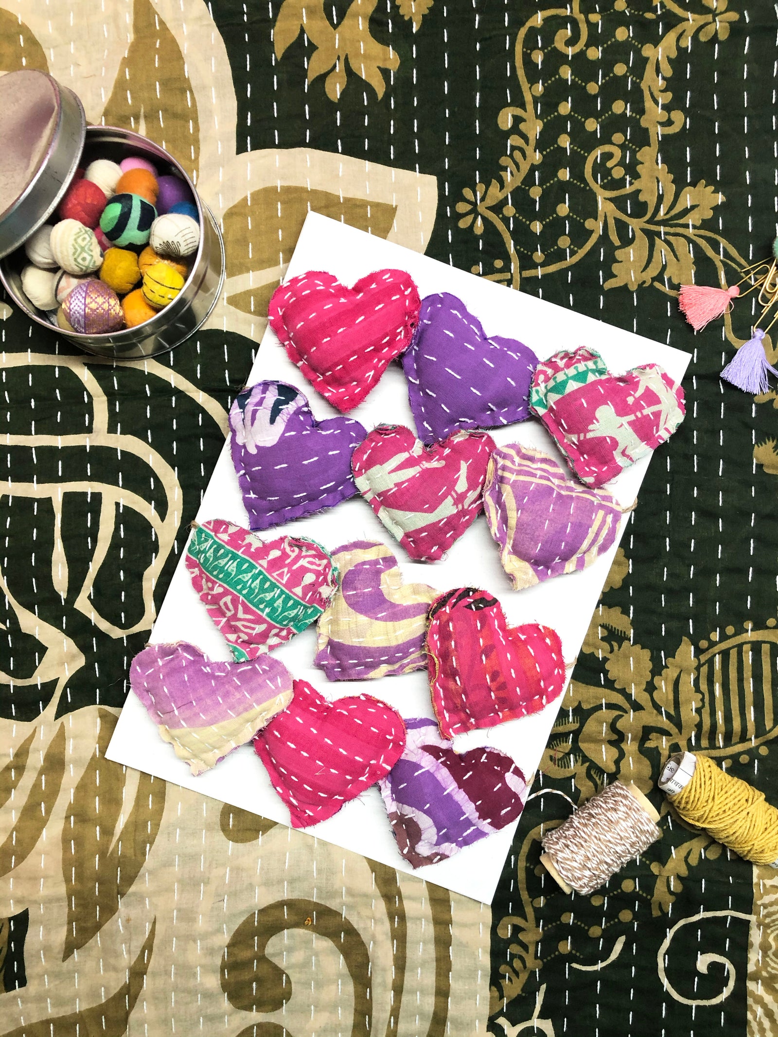 Handmade Kantha heart garland featuring colorful fabric hearts, perfect for adding a festive and traditional touch to your home decor, whether for holidays or everyday celebration.