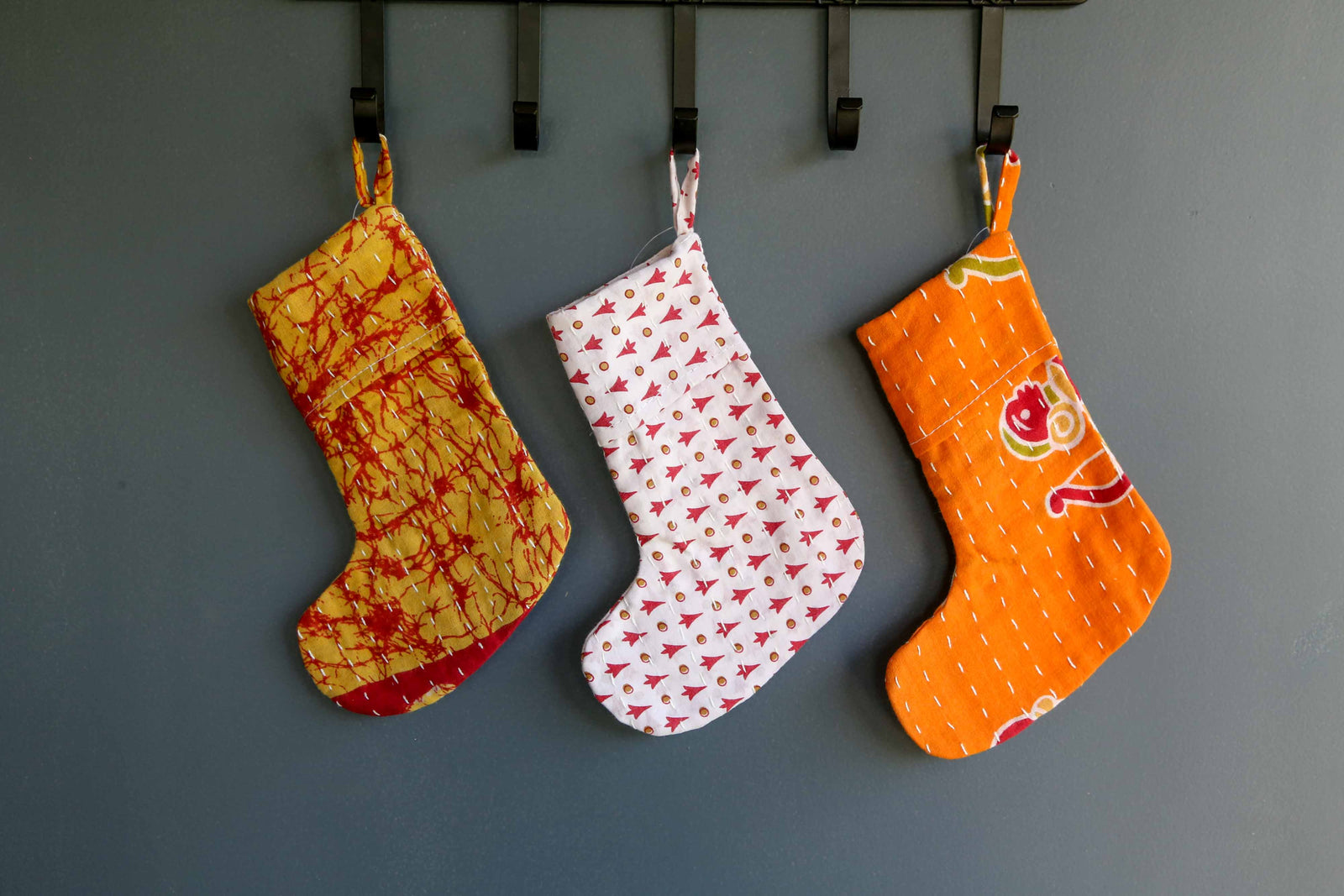 Handmade mini Kantha stocking with vibrant saree patterns, perfect for your little one, pet, or gifting small items, adding a unique touch to holiday decor