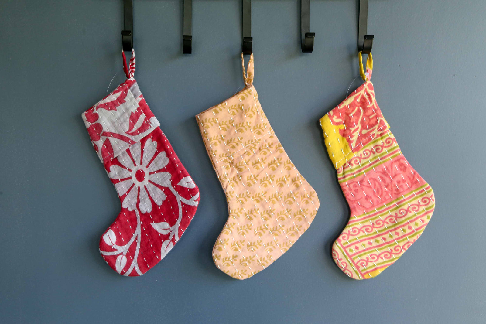 Handmade mini Kantha stocking with vibrant saree patterns, perfect for your little one, pet, or gifting small items, adding a unique touch to holiday decor