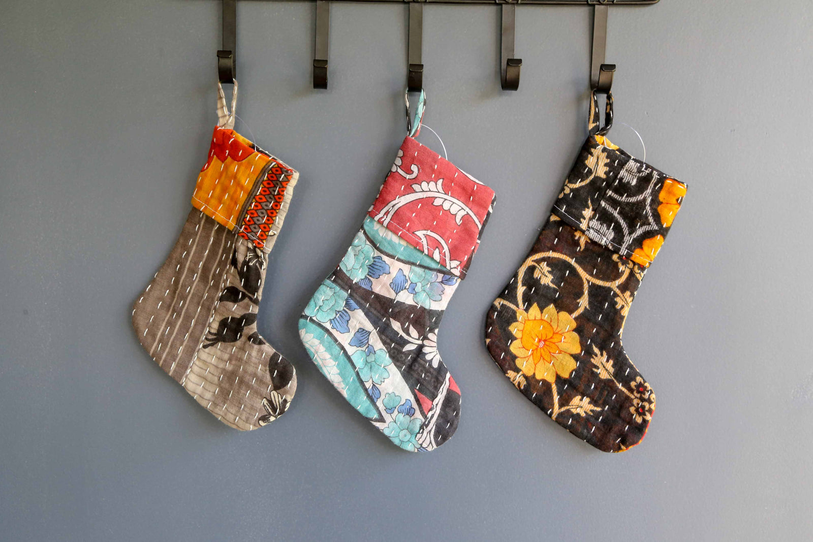 Handmade mini Kantha stocking with vibrant saree patterns, perfect for your little one, pet, or gifting small items, adding a unique touch to holiday decor