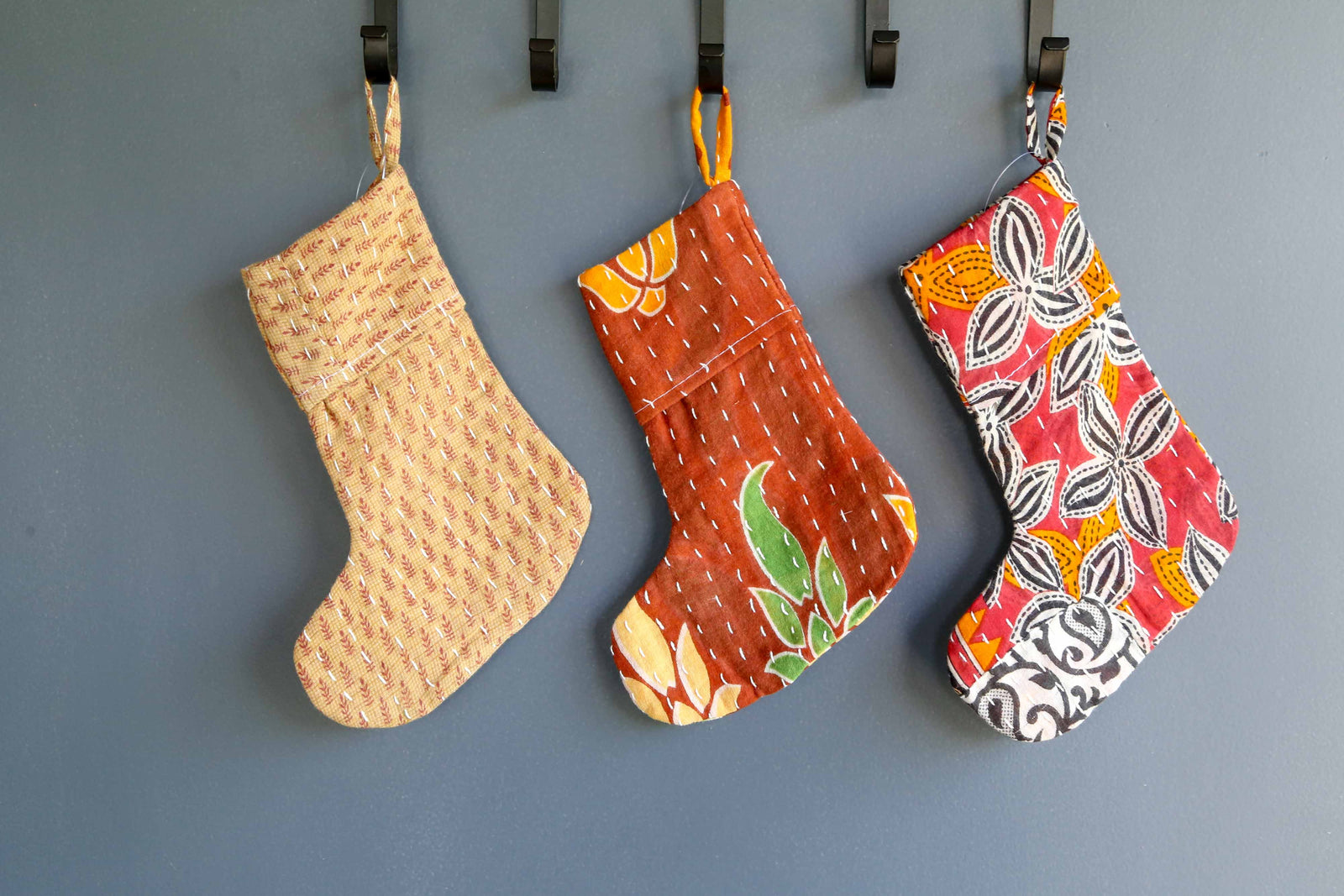 Handmade mini Kantha stocking with vibrant saree patterns, perfect for your little one, pet, or gifting small items, adding a unique touch to holiday decor