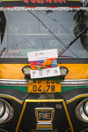 Handmade saree headband with vibrant patterns and traditional stitching, perfect for adding a stylish, eco-friendly touch to your hair for any occasion.