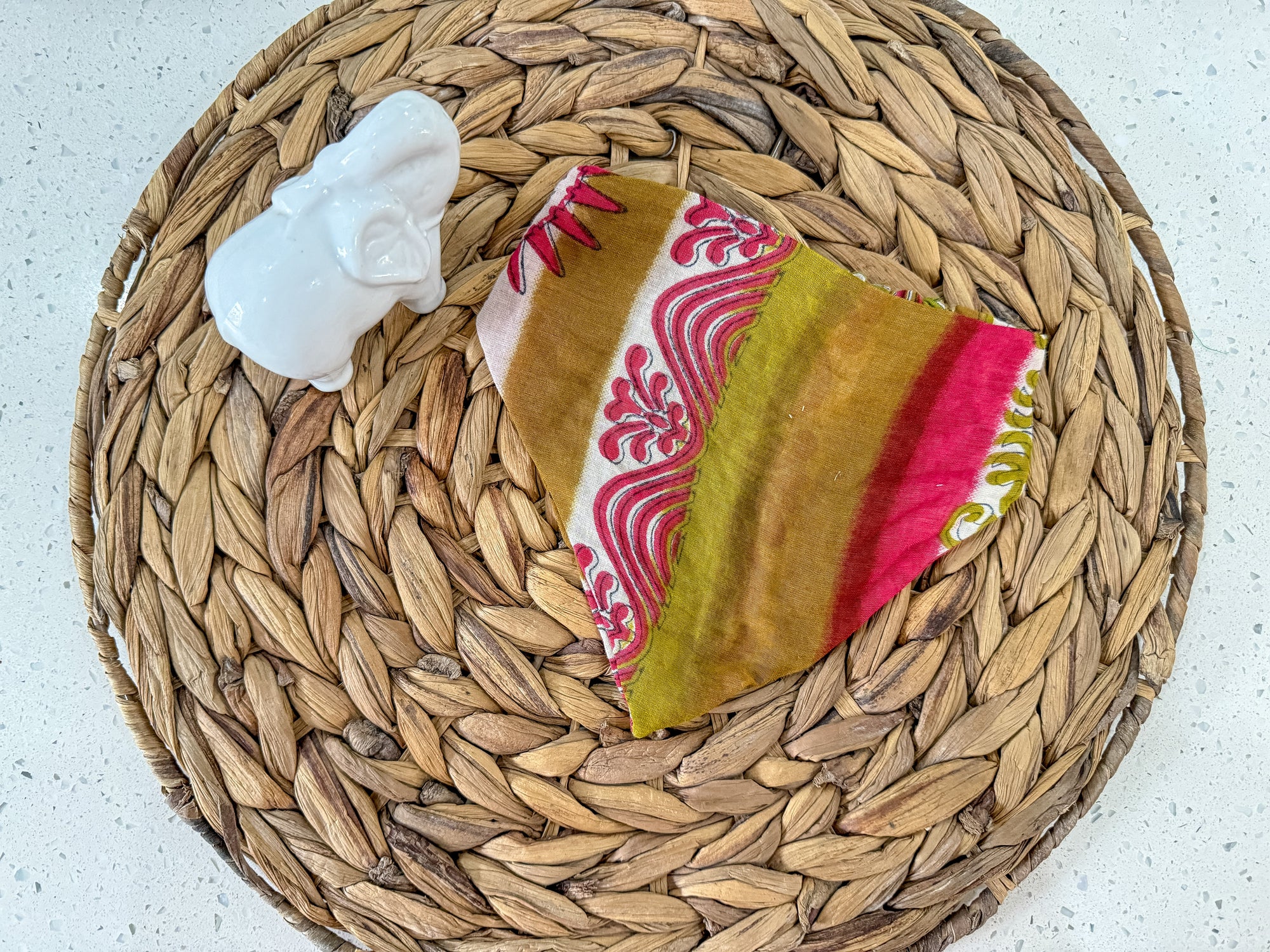 a wicker basket with a cloth on it