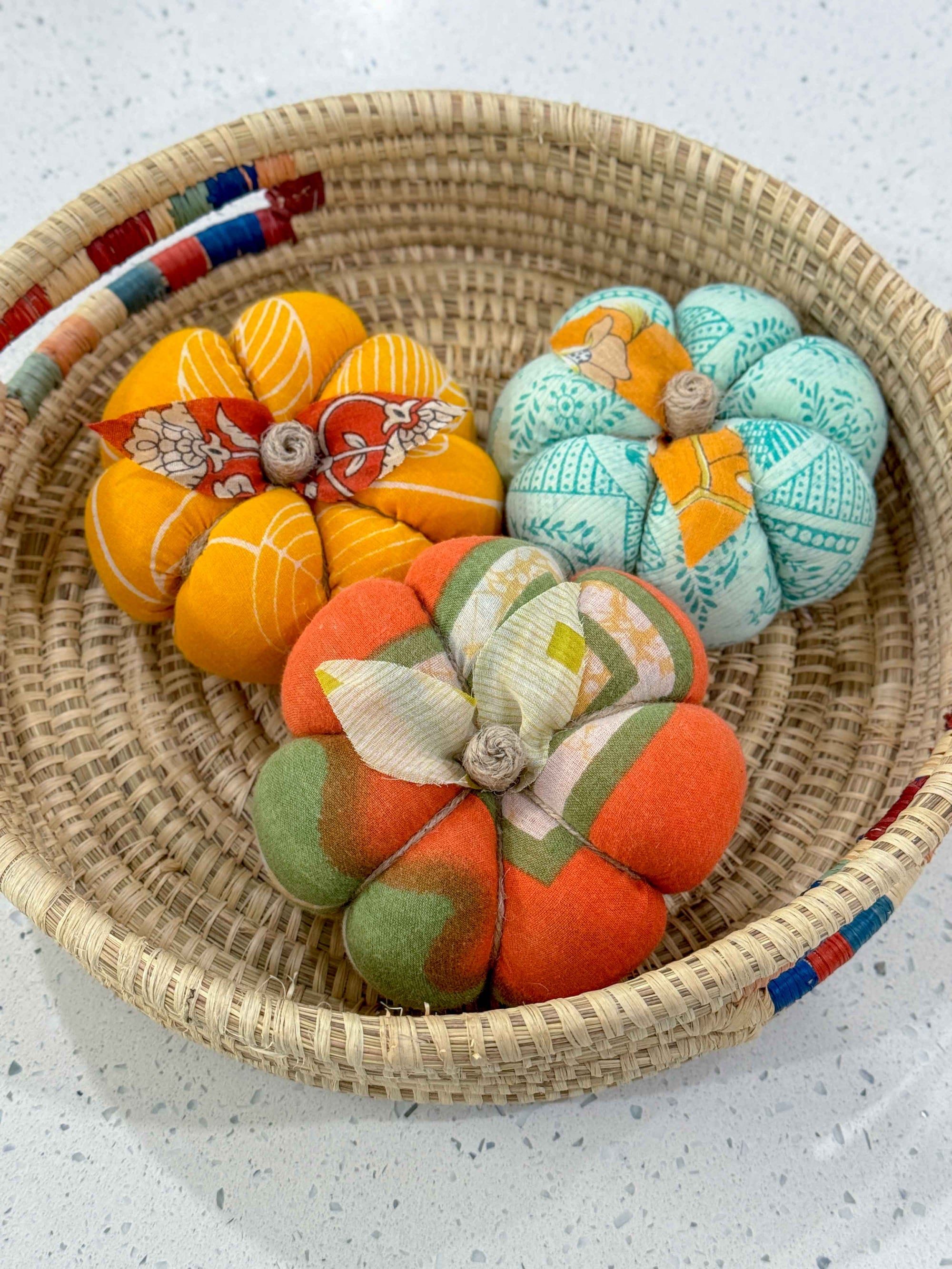 a basket filled with lots of different colored balls