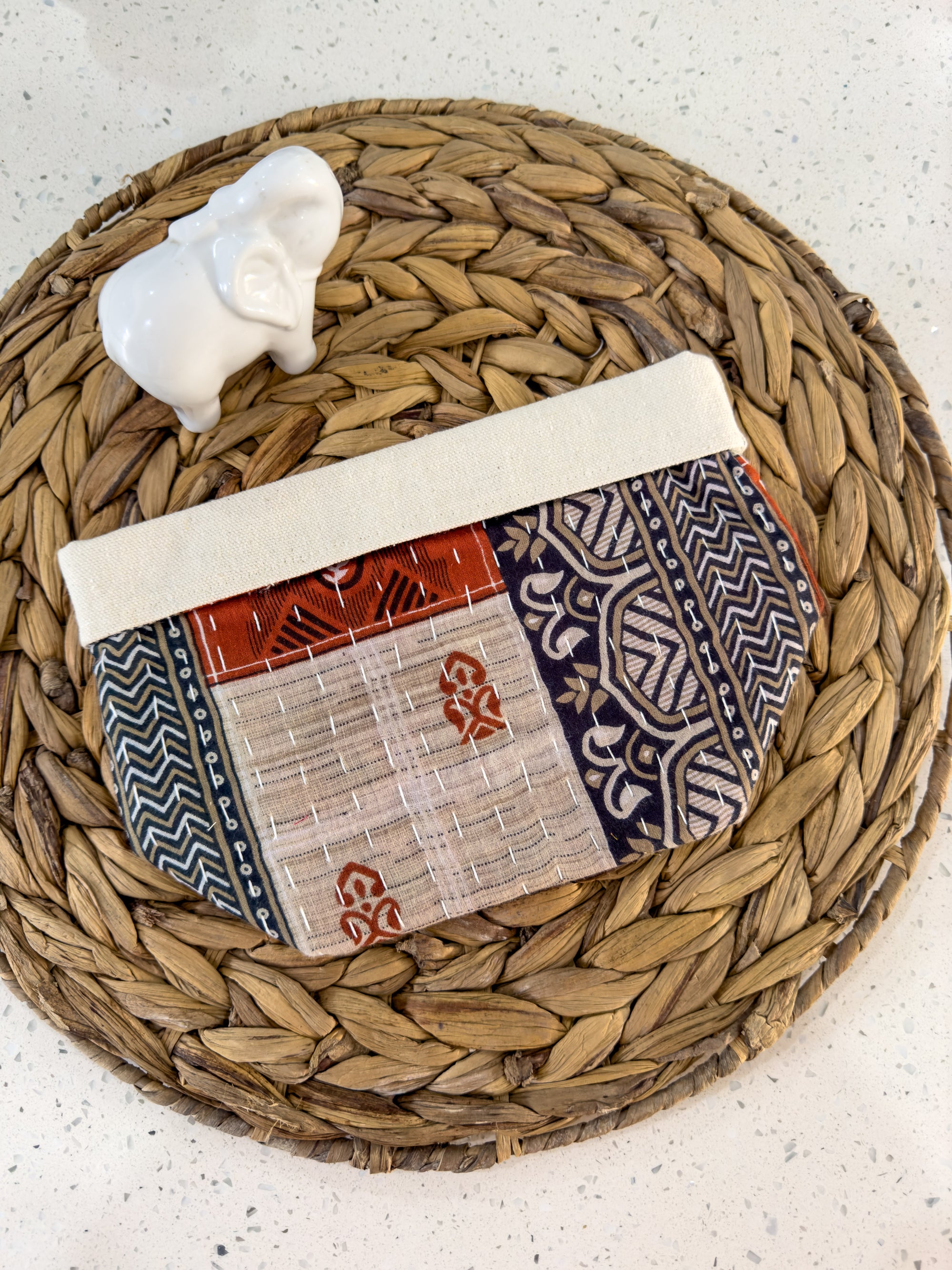 a woven basket with a piece of cloth on top of it