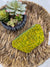 a yellow purse sitting on top of a wicker tray